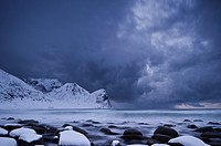 Winter storm over snow covered beach, Unstad, Lofoten islands, Norway