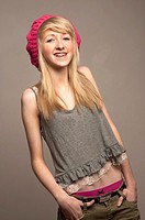 A slim blonde 14 year old teenage girl with dental braces on her teeth, UK