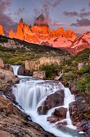 FitzRoy waterfall at dawn under famous rock peak Cerro FitzRoy  El Chalten , Parque Nacional Los Glaciares, Patagonia, Argentina.