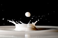 Drops of milk splashing into the air