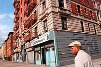 A walk in a commercial street of Harlem, Manhattan New York City