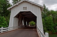 This vintage white covered bridge is a historic landmark in Linn County, Oregon  This is Hoffman bridge, built in the 1930´s circa, over Crabtree Cree...