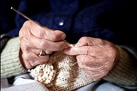 Old woman knitting