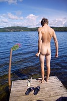 Nude man during holiday at summer cottage. North of Sweden