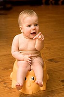 Eight Month Old Baby Sitting Potty