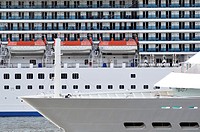 Two cruise ships sail past each other tight, details