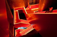 Internal stairs with red lighting at UNESCO Zollverein museum in former coal mine in Essen Germany