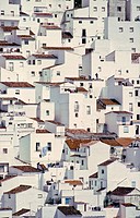 Houses seem to tumble down a steep hillside as if imitating a cubist painting, in the village of Casares, on the edge of the Sierra de Bermeja near Es...