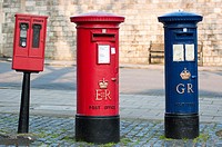 A blue Royal Mail post box George Regina next to a more common red one Elizabeth Regina in Windsor, Berkshire, UK