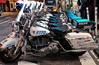 New York Police Department’s Harley-Davidson Electra Glide motorcycles parked in Times Square, 42nd Street, Theater District, and elegant and popular ...