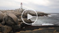 Bagpipes being played and a view of the surf and lighthouse at Peggy´s Cove Nova Scotia Canada