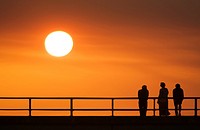 People watching sunset on pier- Jekyll Island, Georgia