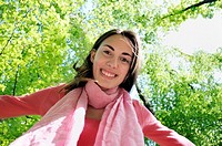 Smiling young woman in woods