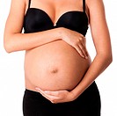 Beautiful pregnant belly of motherhood with hands around wearing black bra and underwear, isolated