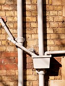 Ironwork drainage pipes on Victorian building, Oxford, UK