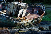 Isle of Mull, Inner Hebrides, Scotland  Abandoned inshore fishing boat decaying on the shore at Salen