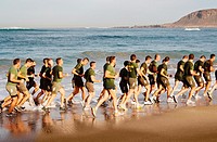 Spanish soldiers running on Las Canteras beach in Las Palmas, Gran Canaria, Canary Islands