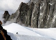 Two climbers seen from Aiguille du Midi , Mont Blanc mountain range, close to Chamonix , Haute-Savoie , Auvergne-Rhône-Alpes, France , Europe