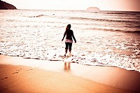 Girl in Laga beach, Biscay, Spain