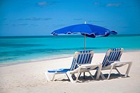 Chairs and umbellas on Shoal Bay East Beach on the caribbean island of Anguilla in the British West Indies