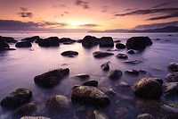 Cove with ´arribolas´ boulders at sunrise, Urdaibai, Vizcaya, Basque Country, Spain