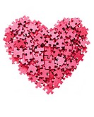 Heart shape symbol made from blank red jigsaw pieces isolated on a white background.