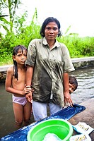 It is common to find locals taking their daily baths and washing their clothins in the public rivers, Bali, Indonesia