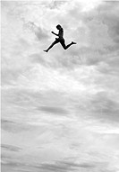 young man jumping from the tower to the jumps in the water, beach on the Geneva Lake in Geneva called ´Paquis plage´, Geneva, Switzerland