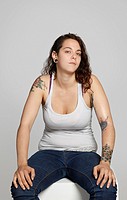 Studio shot of woman with tattoos
