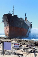 Salvage operators prepare the Phoenix to tow the ship off the rocks, Sheffield Beach, KwaZulu Natal, South Africa