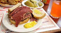 A smoked meat sandwich and pickles at Schwartz´s in Montreal, a Hebrew Delicatessan that opened in 1928  Montreal, Quebec, Canada