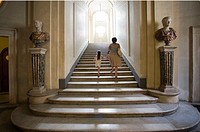 Mother and daughter climbing the stairs of the Doria Pamphili Gallery, Rome