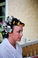 MEDEVI SWEDEN Bride to be has hair in rollers before the wedding.