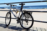 An old bicycle tied up on the boardwalk in Asbury Park, New Jersey, USA
