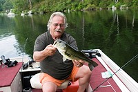 man with a 5LB bass that was caught on Laurel Lake, in Irving, MA, USA.