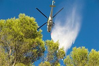 Spain, Balearic Islands, Mallorca, Helicopter stifling wildfire