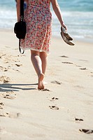 Atlantic Ocean beach, Atlantic Ocean coast, woman walking barefoot on the beach, Portugal