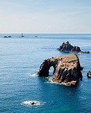 Rock formations off the coast at Lands End Cornwall England UK