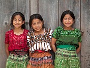 Three Guatemalan girls smiling for photo