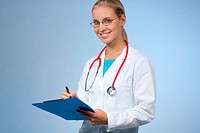 Beautiful female doctor with clipboard