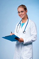 Close-up of a beautiful female doctor with clipboard