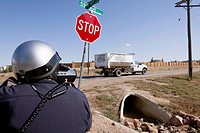 Police officers use radar to check the speed of motorists in Greely, Colorado, USA, October 3, 2011.