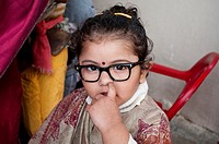 Nursery school - girl dressed up as a teacher picking her nose, Chandigarh, India