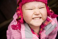 Portrait of a young girl with pediatric cancer leukaemia smiling at the camera  She has just lost her hair after a strong dose of chemo therapy but is...