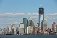 The rising One World Trade Center Freedom Tower and Manhattan skyline in New York City as viewed from New York Harbor