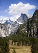 Half Dome and Yosemite valley under blue sky and clouds