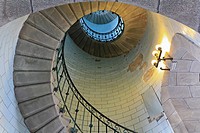 Angle shot of a lighthouse´s spiral stair lighted by electric lamp, vortex
