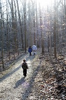 A young boy follows his Father and older brother on an Ohio trail