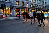 Women crossing a street at central London, UK, Europe