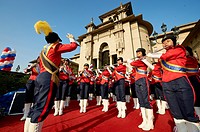 A traditional marching band playing outside the parliament building